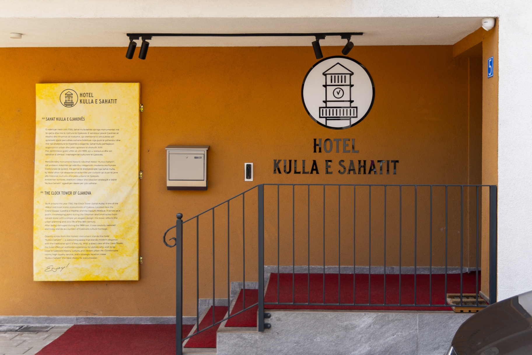 Hotel entrance with heritage plaque and keypad access